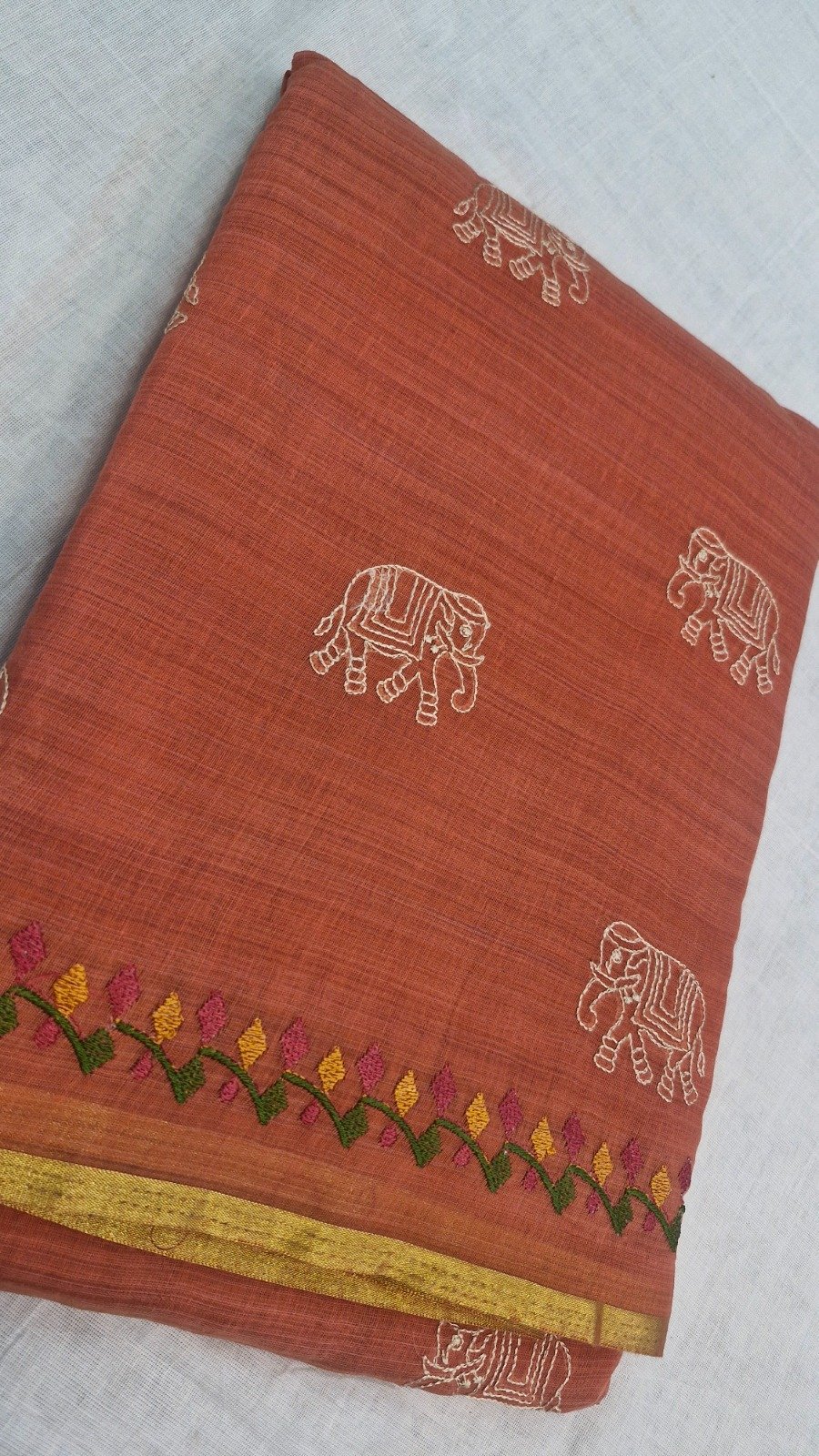 Terracotta Peach With White Elephant Embroidered Designer Pure Cotton Saree Terracotta Peach With White Elephant Embroidered Designer Pure Cotton Saree